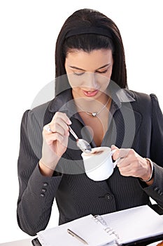 Businesswoman enjoying cappuccino