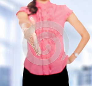 Businesswoman extending hand to shake photo