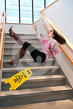 Businesswoman Falling on Stairs