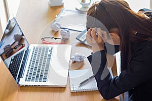 Businesswoman feeling stress from work.