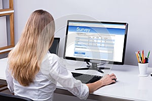 Businesswoman Filling Online Survey Form