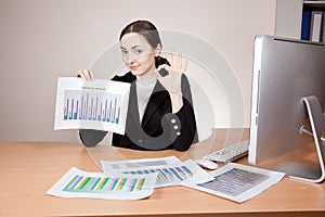 Businesswoman with financial reports