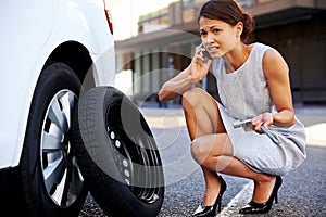 Businesswoman flat tire photo