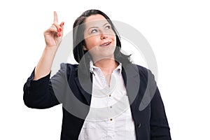 Businesswoman in formalwear making idea gesture with finger