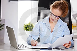 Businesswoman freelancer working at a computer at Christmas