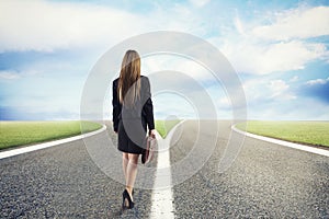 Choices of a businesswoman at a crossroads. Concept of decision photo