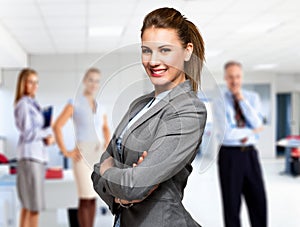 Businesswoman in front of a group of business people