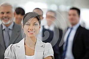 Businesswoman in front of sales team