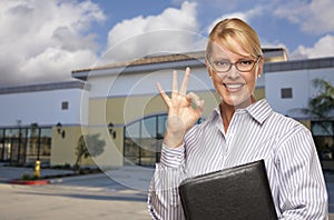 Businesswoman In Front of Vacant Office Building