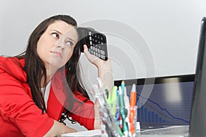 Businesswoman frustated with work, has a lot of work at the office photo