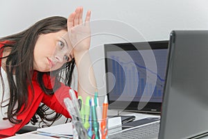 Businesswoman frustated with work, has a lot of work at the office photo