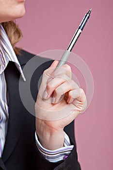 Businesswoman gesturing with pen