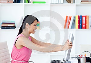 Businesswoman getting frustrated with a computer