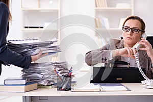 The businesswoman getting more work during busy time