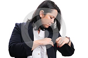 Businesswoman getting ready checking chest pocket of suit