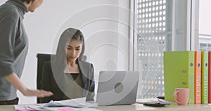 Businesswoman getting rebuke from his female boss in the office.