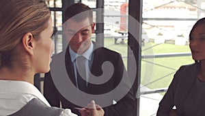 Businesswoman giving business card and handshake