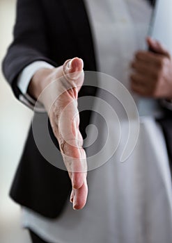 businesswoman giving hand to handshake