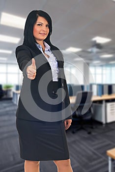 Businesswoman giving thumbs up