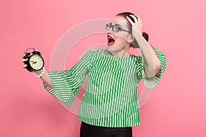 Businesswoman with hair bun and clocks