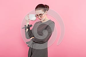 Businesswoman with hair bun and cup