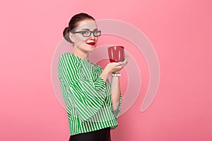 Businesswoman with hair bun and cup