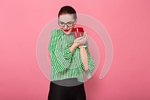 Businesswoman with hair bun and cup