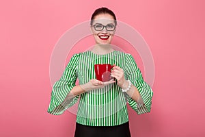 Businesswoman with hair bun and cup