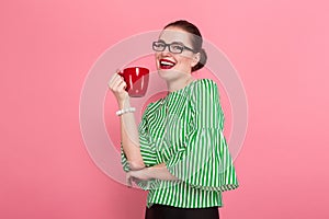 Businesswoman with hair bun and cup