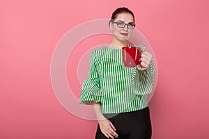 Businesswoman with hair bun and cup