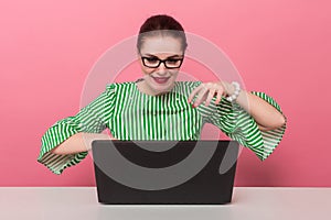 Businesswoman with hair bun and laptop