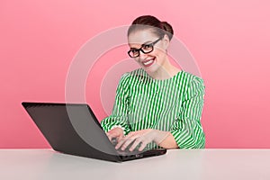 Businesswoman with hair bun and laptop