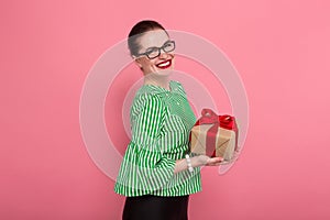 Businesswoman with hair bun and present