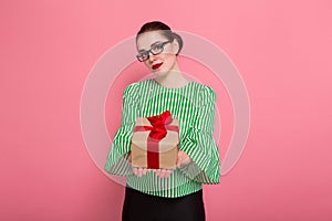 Businesswoman with hair bun and present