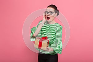 Businesswoman with hair bun and present