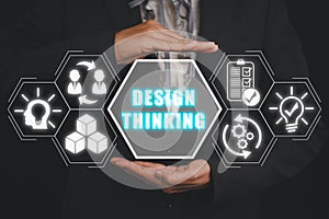 Businesswoman hand holding design thinking icon on virtual screen