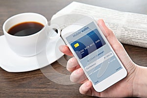 businesswoman hand holding a phone with mobile wallet onlain shopping on the screen