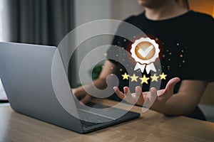 Businesswoman hand holding virtual icon providing a five-star premium service. hand woman showing award high standards are