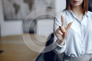 Businesswoman hand pushing screen at the office