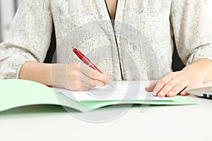 Businesswoman hand signing a contract