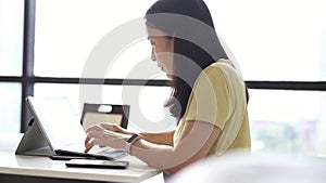 Businesswoman hand typing on laptop keyboard working at home.