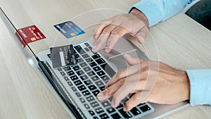 Businesswoman hand use laptop and credit card to online shopping from home, payment e-commerce, internet banking, spending money