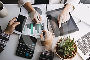 businesswoman hand working with laptop computer, tablet and smart phone in modern office with virtual icon diagram at modernoffice