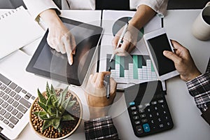 businesswoman hand working with laptop computer, tablet and smart phone in modern office with virtual icon diagram at modernoffice