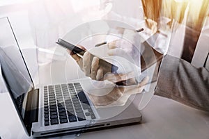 businesswoman hand working with laptop computer, tablet and smart phone in modern office with virtual icon diagram at modernoffice