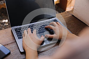 businesswoman hand working with laptop computer, tablet and smart phone in modern office with virtual icon diagram at modernoffice