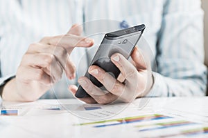 Businesswoman hands analyzing financial statistics.