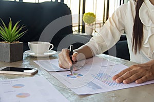 Businesswoman hands analyzing financial statistics. Analysis of