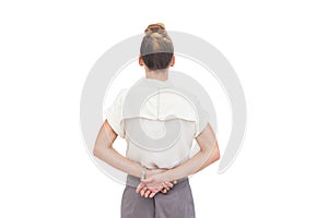 Businesswoman with hands behind her back