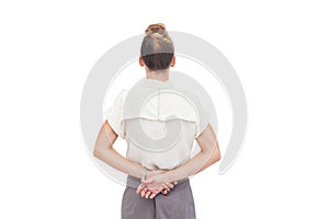 Businesswoman with hands behind her back photo